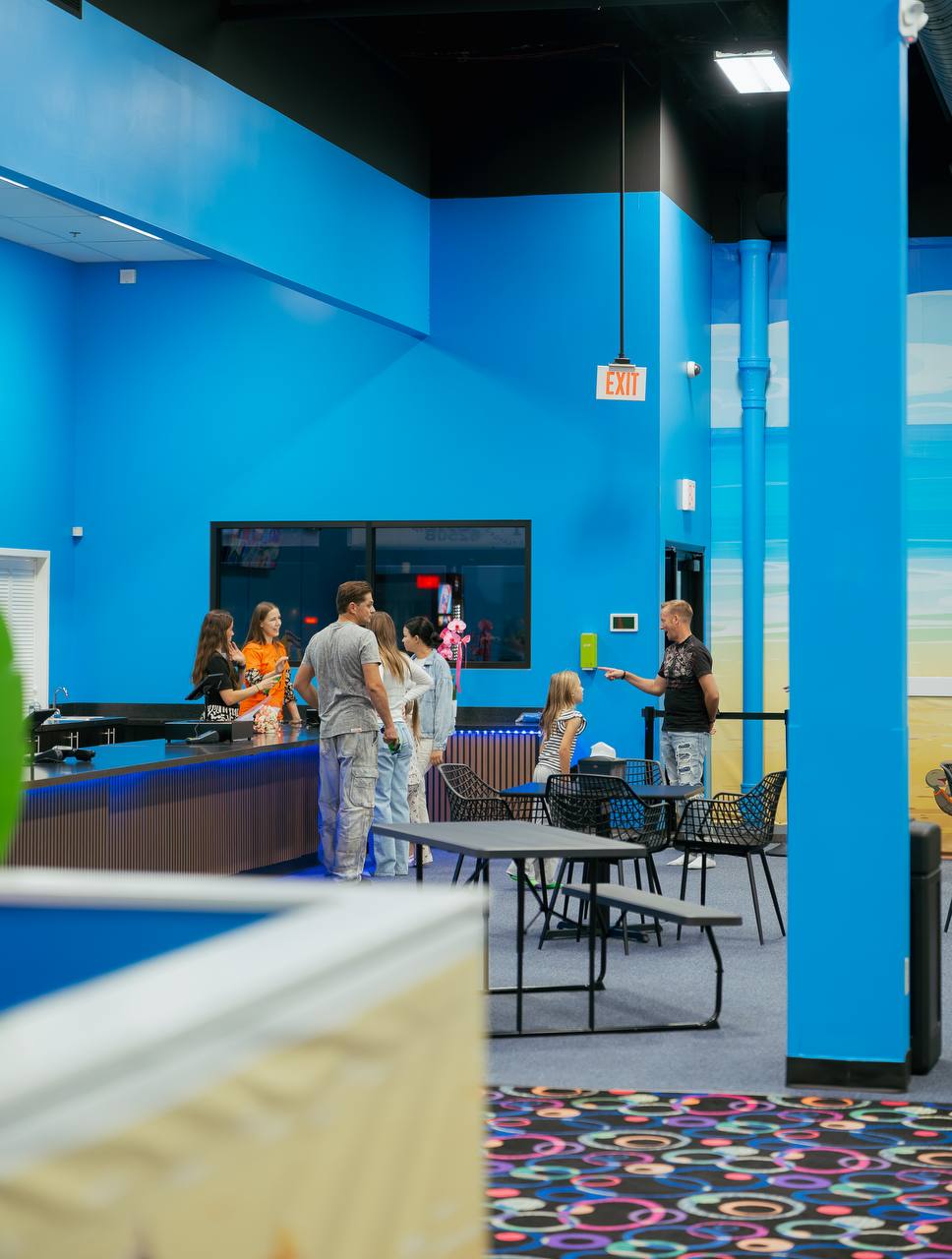 Front desk and seating area at the indoor playground in Crystal Lake, IL